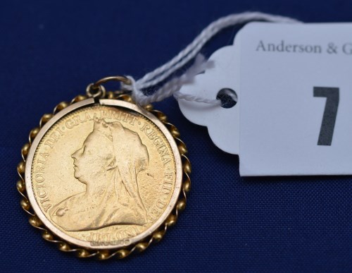 Lot 7 - A Victorian gold sovereign, 1900, on yellow...