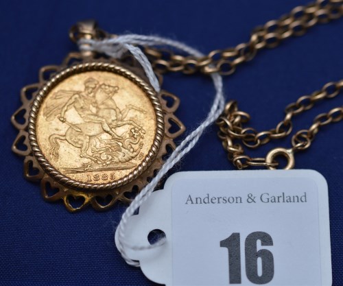 Lot 16 - A Victorian gold sovereign, 1885, in 9ct....