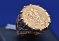 Lot 73 - An Edward VII gold sovereign, 1907, in 9ct....