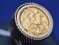 Lot 105 - An Edward VII gold sovereign, 1910, in 9ct....