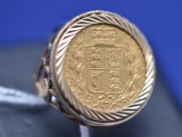 Lot 118 - A Victorian gold sovereign, 1973, in 9ct....