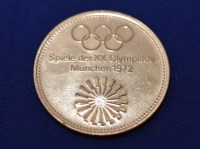 Lot 131 - A 22ct. yellow gold Olympic medal,...