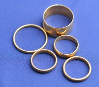 Lot 165 - Five 22ct. yellow gold wedding bands, all...
