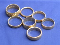 Lot 183 - Seven 18ct. yellow gold wedding bands, mainly...
