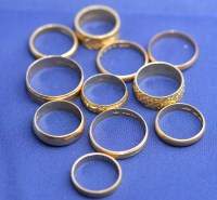 Lot 186 - Eleven 18ct. yellow gold wedding bands, two...