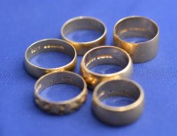 Lot 188 - Six 18ct. yellow gold broad wedding bands, one...