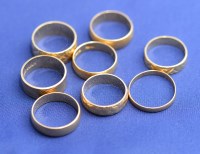 Lot 190 - Eight 18ct. yellow gold wedding bands, some...