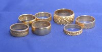 Lot 193 - Seven 18ct. yellow gold wedding bands, some...