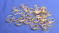 Lot 201 - A large quantity of 9ct. yellow gold wedding...