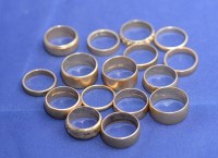 Lot 202 - A quantity of 9ct. yellow gold wedding bands,...