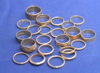 Lot 210 - A quantity of 9ct. gold wedding bands, some...