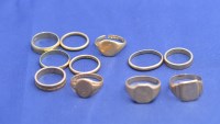 Lot 219 - Four yellow metal rings, stamped for 14ct....