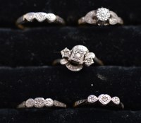 Lot 223 - Five diamond rings, four three-stones and one...