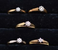 Lot 233 - Five single-stone diamond rings, in illusion...
