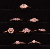 Lot 239 - Eight diamond rings, in illusion settings on...