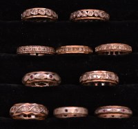 Lot 245 - Ten eternity rings, mainly set with white...