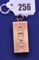 Lot 256 - A 9ct. yellow gold ingot pendant, 61.2grms.