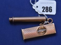 Lot 286 - A 9ct. yellow gold mounted cigar cutter with...