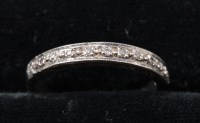 Lot 292 - A diamond half hoop eternity ring, set with...