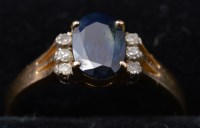 Lot 293 - A sapphire and diamond ring, the oval...