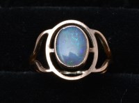 Lot 297 - An opal ring, the oval opal in collet setting...