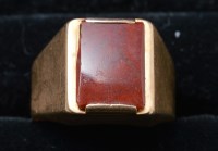 Lot 298 - A bloodstone set signet ring, the rectangular...