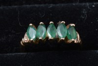 Lot 299 - An emerald ring, the five marquise-cut...