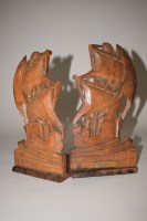 Lot 151 - A pair of folding bookends, carved from teak...