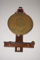 Lot 178 - A wall mounted gong, the brass plate engraved...