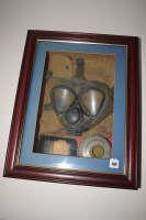 Lot 184 - A German military gas mask, by Drager, mounted...
