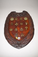 Lot 199 - A WWI carved oak shields inscribed '1914-15'...