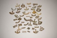 Lot 213 - A large quantity of pierced brass cap badges...