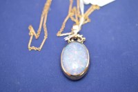 Lot 403 - An opal and agate set fob on 9ct. gold mount...