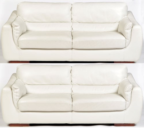 Lot 914 - A pair of modern white leather two-seater...