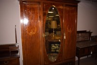 Lot 992 - An Edwardian inlaid mahogany bedroom suite,...