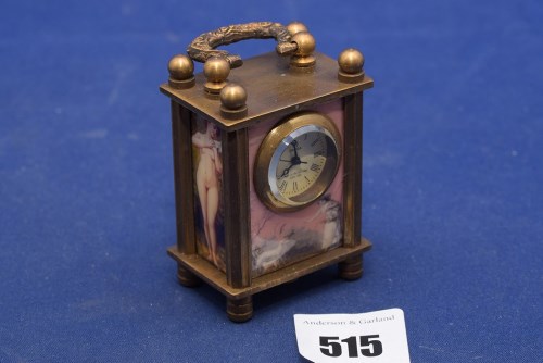 Lot 515 - An Omega Swiss miniature brass carriage clock,...