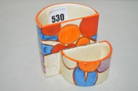 Lot 530 - A Clarice Cliff cigarette and match holder in...