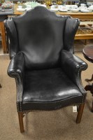 Lot 1041 - A George III style black leather armchair,...