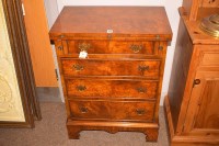 Lot 1146 - A reproduction walnut bachelors chest in the...