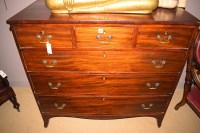 Lot 1155 - A Georgian mahogany chest of three short and...