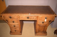 Lot 1164 - A late 19th Century oak kneehole desk with...