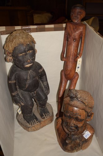 Lot 395 - Three African carved figure ornaments, various,...
