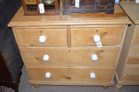 Lot 663 - A late 19th Century stripped pine chest of two...