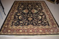 Lot 694 - A Persian carpet, with floral scrolls on black...