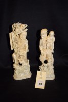 Lot 69 - Two Meiji period carved ivory groups: a man...