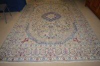Lot 710 - A Tabriz carpet with full floral scrolling...