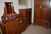 Lot 726 - A three piece stained wood bedroom suite by...