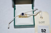 Lot 52 - A sapphire and diamond ring, the emerald-cut...