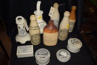Lot 317 - A collection of stoneware bottles and pots,...