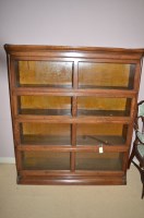 Lot 867 - An oak sectional bookcase of four sections,...